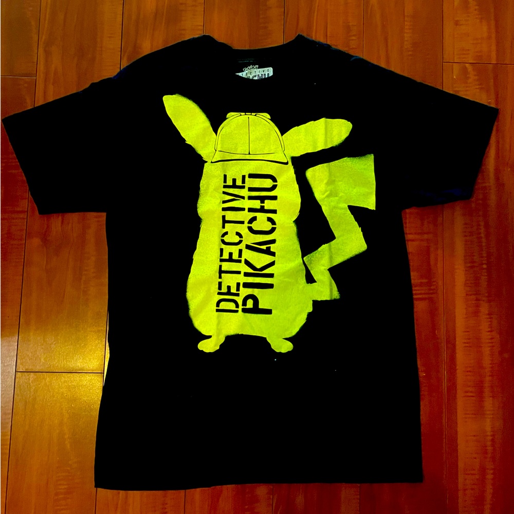 Detective Pikachu shirt w/ detective Pikachu ears and phone pop up.